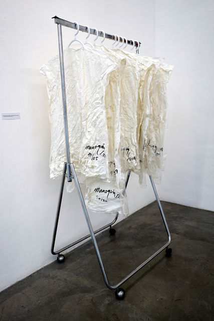Raul Marroquin, Rack with painted plastic clothes, One size fits all, rags for the condemned ones, 2019