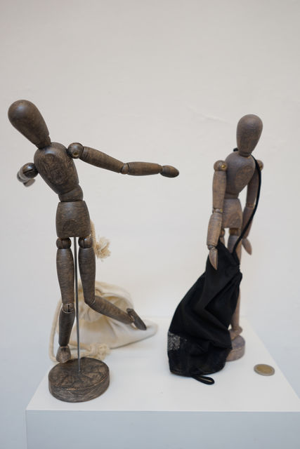 Raul Marroquin, Mannequins with graphite and money bags, Italian 2 € coins, Prodigals fighting the avaricious, 2018